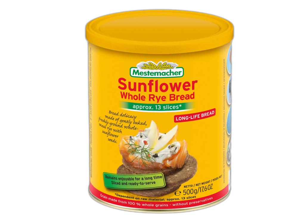 Asparagus salad in a glass jar with and Mestemacher Sunflower Whole Rye Bread